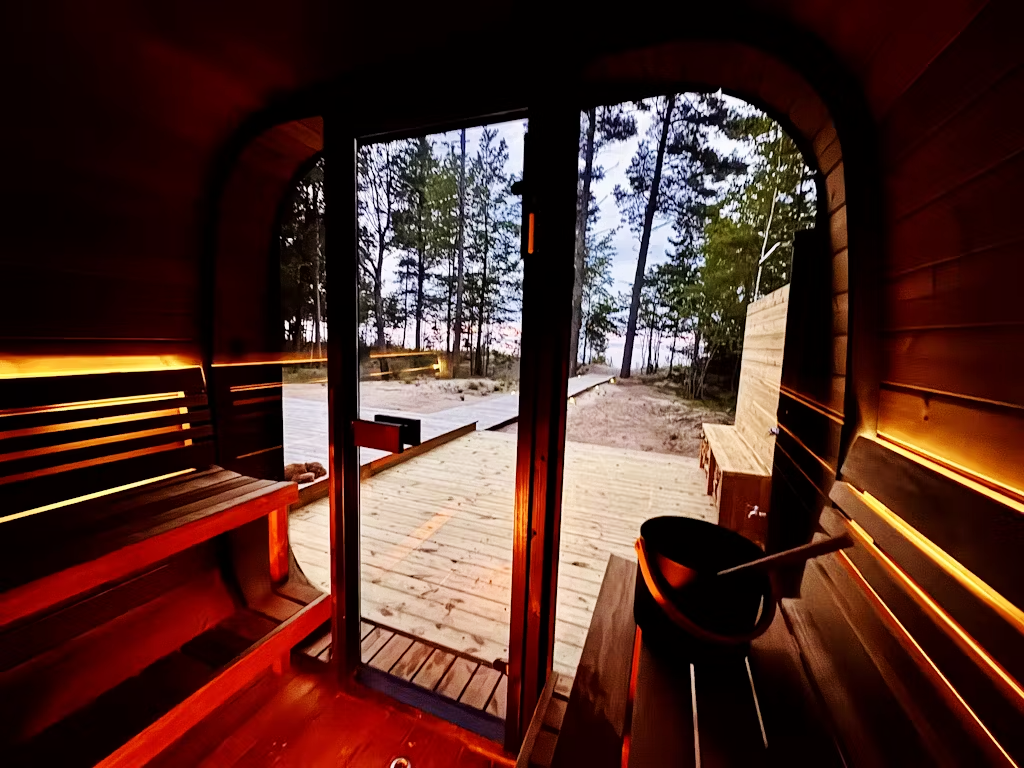 6 Person Outdoor Cube Sauna installed on a wooden deck in Texas, CL7G, Öli Saunas showroom