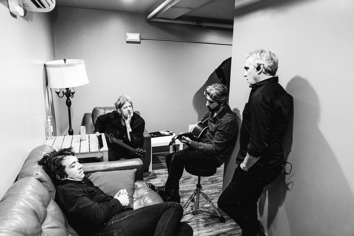 Gerardo Larios performing on stage with Spoon