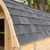 Black asphalt shingle roof with trim for Dundalk Tranquility barrel saunas